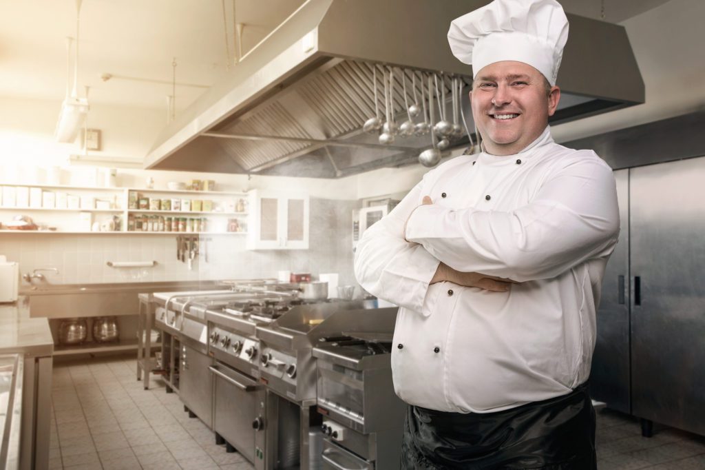 Chef In An Industrial Kitchen